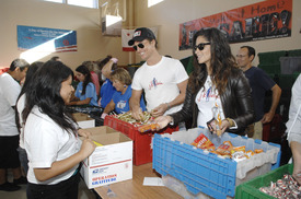 Matthew McConaughey and Camila Alves smiled while doing charity work at the Operation Gratitude Event in October 2009 in LA.jpg