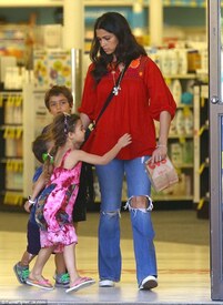 Flash of colour_ Dressed down for the outing, Camila couldn't be missed in a bright red floaty top with a patterned chest piece.jpg