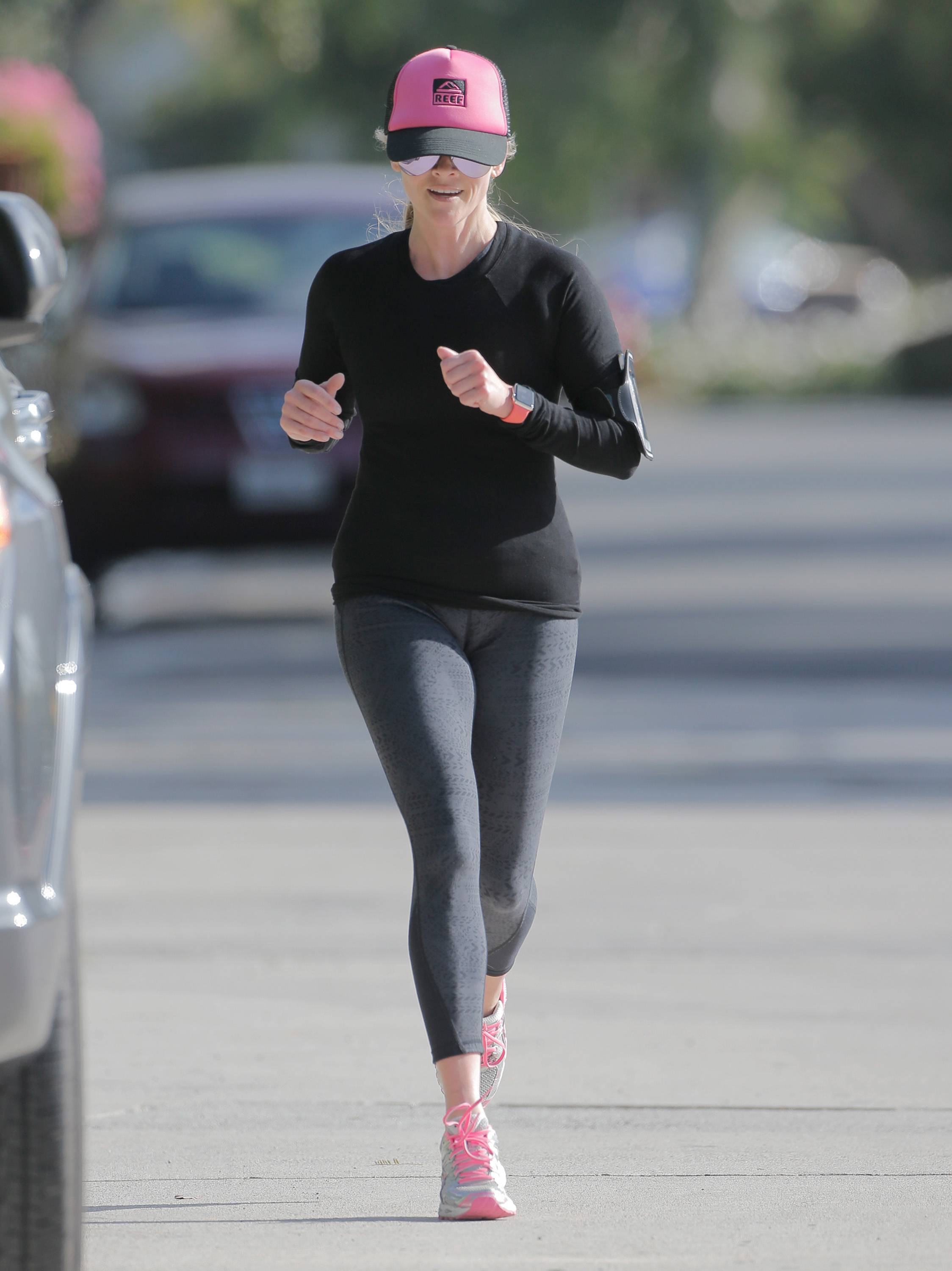 Reese Witherspoon goes for her morning jog in LA 3/30/16.