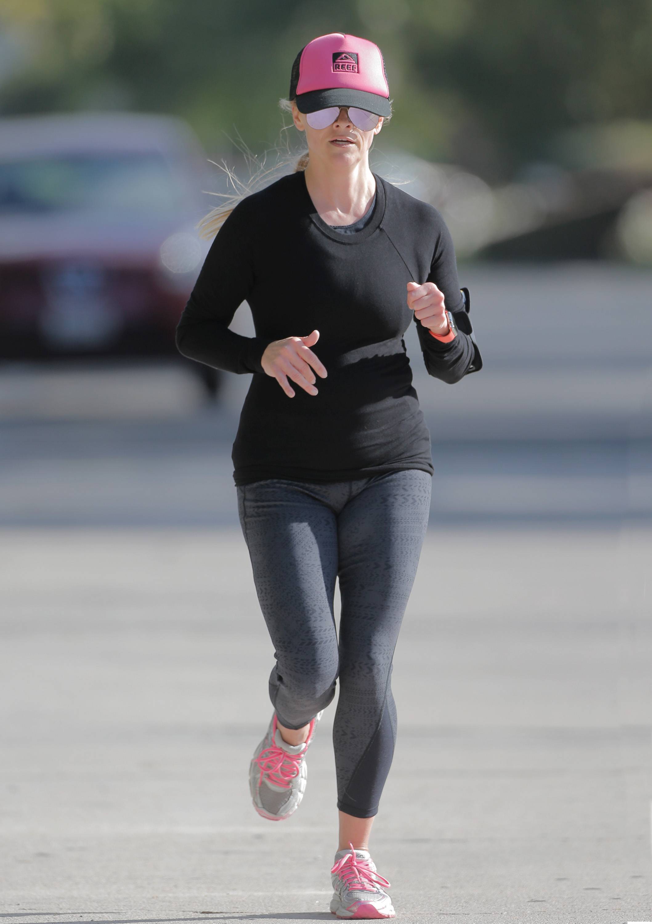Reese Witherspoon goes for her morning jog in LA 3/30/16.