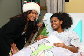 celebrity-paradise.com-The_Elder-Adrienne_Bailon_2009-12-23_-_Visits_Children_At_The_Beth_Israel_Medical_Center_230.jpg