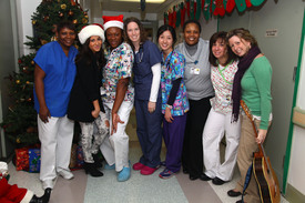 celebrity-paradise.com-The_Elder-Adrienne_Bailon_2009-12-23_-_Visits_Children_At_The_Beth_Israel_Medical_Center_9168.jpg