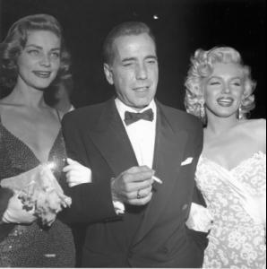 87336_lauren_bacall_humphrey_bogart_and_marilyn_monroe_attend_the_premiere_of_her_movie_how_to_marry_a_mil.jpg