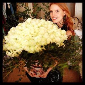 Jessica-Chastain-showered-white-roses.jpg