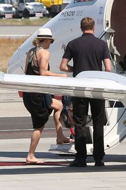 kaley-cuoco-boarding-at-a-private-jet-in-van-nuys-06-20-2016_12.jpg