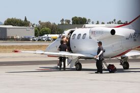 kaley-cuoco-boarding-at-a-private-jet-in-van-nuys-06-20-2016_14.jpg