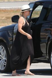 kaley-cuoco-boarding-at-a-private-jet-in-van-nuys-06-20-2016_8.jpg
