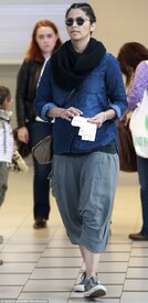 Time to kick-back_ The model and TV presenter teamed a baggy dark denim shirt with a pair of baggy grey harem pants and grey trainers.jpg