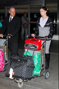 46421_laetitia_casta_arrives_into_lax_080508_18_12.jpg