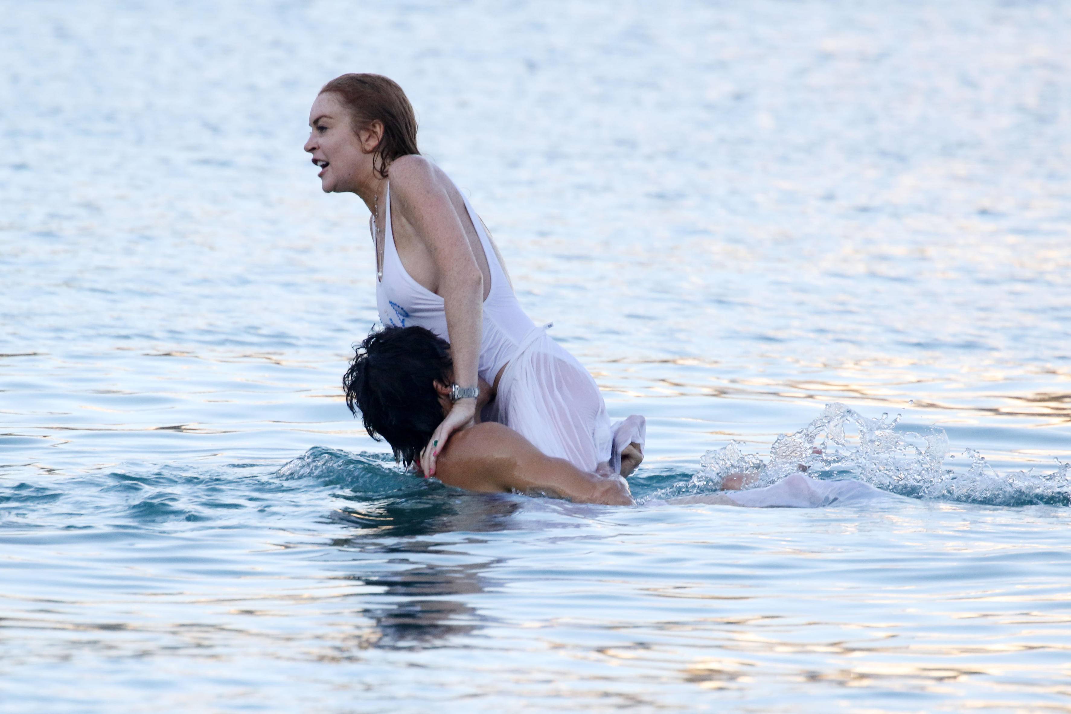 Lindsay Lohan at the beach in Mykonos, Greece 7/4/2016. addons. 