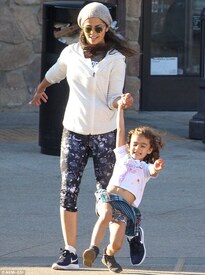 Mother-daughter time_ The 34-year-old let her six-year-old daughter Vida swing playfully as they held hands.jpg