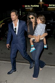 The 46-year-old wore a dapper blue suit as he affectionately guided his wife and son back to their lodgings.jpg