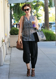 Lily Collins is all smiles while enjoying a shopping trip_12.jpg