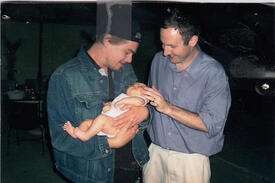 Leo holding a baby.jpg