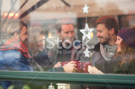 stock-photo-53257786-friends-having-hot-drinks-outdoors-in-winter-city.jpg