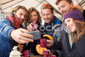 stock-photo-53763884-friends-having-hot-drinks-outdoors-in-winter-city.jpg