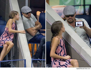 0913-leo-dicaprio-showing-girl-phone-us-open-splash-4.jpg