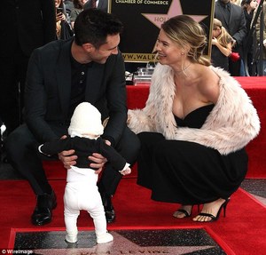 3D10049200000578-4213518-The_couple_beamed_at_each_other_as_Levine_held_their_daughter_in-a-37_1486768374655.jpg