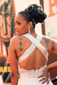 -Vivica-Fox-Cross-Tattoo.jpg