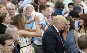 41A895B800000578-4631096-Melania_Trump_holds_a_baby_in_the_air_as_Donald_Trump_poses_for_-a-50_1498181895471.jpg