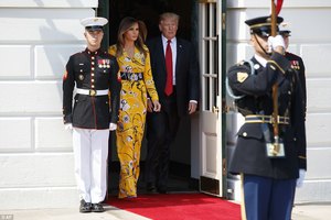 41C9354900000578-4641364-First_Lady_Melania_Trump_stepped_out_Monday_wearing_a_bright_yel-a-12_1498533005826.jpg