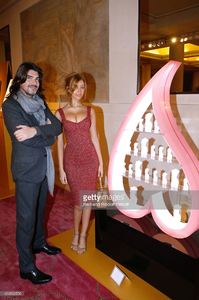 fashion-designer-stephane-rolland-and-zahia-dehar-poses-in-front-of-picture-id459662556.jpg