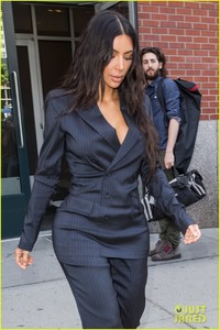 kim-kardashian-flaunts-her-curves-in-pin-striped-suit-04.jpg