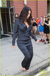 kim-kardashian-flaunts-her-curves-in-pin-striped-suit-18.jpg