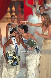 miss-tahiti-now-miss-france-1999-kisses-miss-paris-who-came-second-picture-id667980256.jpg