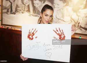 miss-universe-2017-iris-mittenaere-visit-buca-di-beppo-times-square-picture-id698477882.jpg