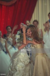 sophie-thalmann-miss-france-1998-hands-on-her-crown-to-the-winner-picture-id667980520.jpg