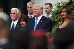 4209407300000578-4665960-Vice_President_Mike_Pence_left_with_his_wife_Karen_Pence_stands_-a-2_1499217847650.jpg