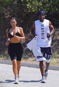 421F4A4E00000578-4675698-Feeling_the_heat_Kim_wore_a_sports_bra_and_cycling_shorts_for_he-a-96_1499448200350.jpg
