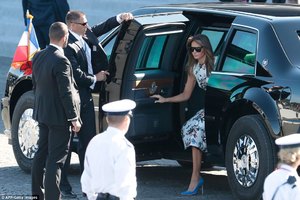 425333D900000578-4695630-Brigitte_Macron_greeted_them_at_10_10_am_local_time_as_her_husba-a-22_1500022003974.jpg