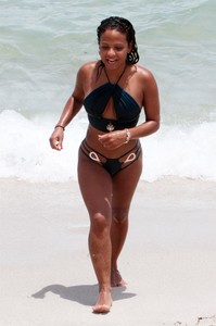 47715290_christina-milian-emerald-bikini-on-the-beach-in-miami-35.jpg