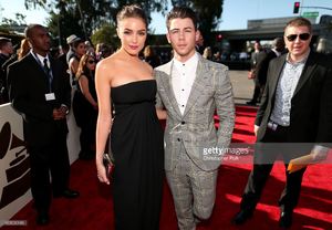 actress-olivia-culpo-and-recording-artist-nick-jonas-attend-the-57th-picture-id463010146.jpg