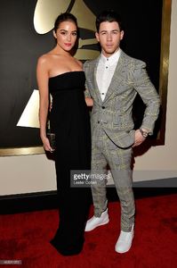 actress-olivia-culpo-and-recording-artist-nick-jonas-attend-the-57th-picture-id463011972.jpg