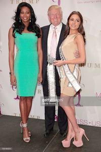 donald-trump-positions-himself-between-the-new-miss-usa-nana-and-picture-id159180921.jpg