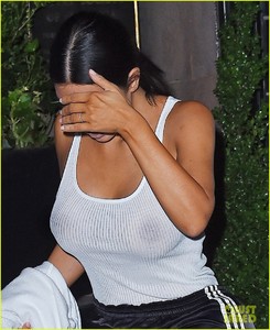 kim-kardashian-goes-braless-in-see-through-top-07.jpg