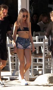 lottie-moss-in-ripped-jean-shorts-and-a-sports-bra-beach-in-mykonos-07-29-2017-13.jpg