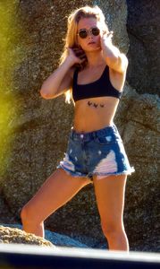 lottie-moss-in-ripped-jean-shorts-and-a-sports-bra-beach-in-mykonos-07-29-2017-8.jpg