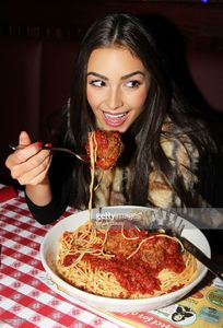 miss-universe-olivia-culpo-visits-buca-di-beppo-times-square-on-april-picture-id166556714.jpg
