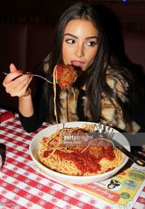 miss-universe-olivia-culpo-visits-buca-di-beppo-times-square-on-april-picture-id166556732.jpg