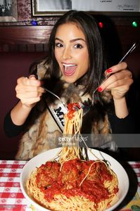 miss-universe-olivia-culpo-visits-buca-di-beppo-times-square-on-april-picture-id166556758.jpg