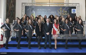 montpelliers-mayor-philippe-saurel-miss-france-2016-iris-mittenaere-picture-id627412040.jpg