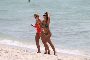 natasha-oakley-and-devin-brugman-in-bikinis-beach-in-miami-07-19-2017-22.jpg