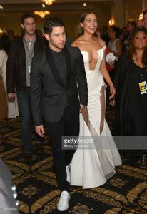 nick-jonas-and-olivia-culpo-attend-the-63rd-annual-miss-universe-red-picture-id462204420.jpg