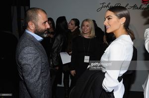 numan-ataker-and-olivia-culpo-talk-backstage-at-the-john-paul-ataker-picture-id635315112.jpg