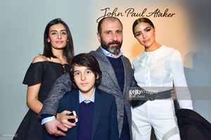 numan-ataker-with-family-and-olivia-culpo-at-the-john-paul-ataker-picture-id635358944.jpg