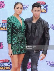 olivia-culpo-and-nick-jonas-arrive-at-the-2015-radio-disney-music-at-picture-id471178202.jpg